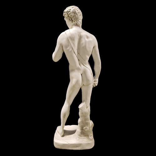 Classical Renaissance male statue with detailed anatomy, curly hair, and contrapposto stance on a rectangular base. Side View