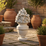 Ornate classical urn finial with intricate Baroque floral detailing and old world European sculptural design. Side Angle