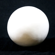 Sculpted sphere with smooth, minimalist surface, inspired by classical and old world European geometric forms. Side View