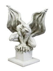 Gothic gargoyle statue with outstretched wings, crouching posture, and ornate, medieval-inspired detailing on a square pedestal.