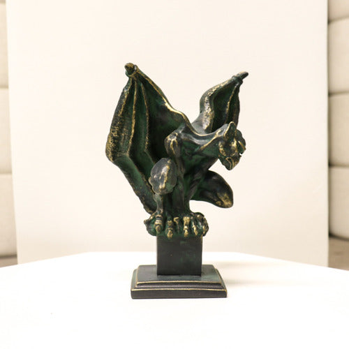 Gothic gargoyle statue with outstretched wings and crouching pose on a square pedestal, featuring ornate medieval detailing. Side Angle