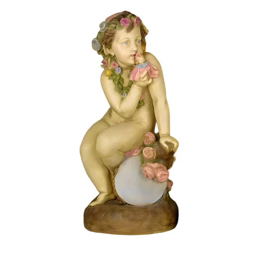 Cherub statue in classical Renaissance style, adorned with ornate floral garlands and seated on a decorative orb.
