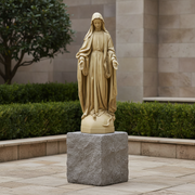 Madonna statue in classical Renaissance style with flowing drapery, serene expression, and outstretched hands on ornate pedestal. Side View