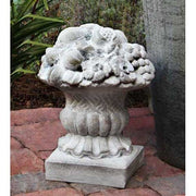Ornate classical urn with intricate fruit and floral relief, featuring old world European and Baroque decorative detailing. Side View
