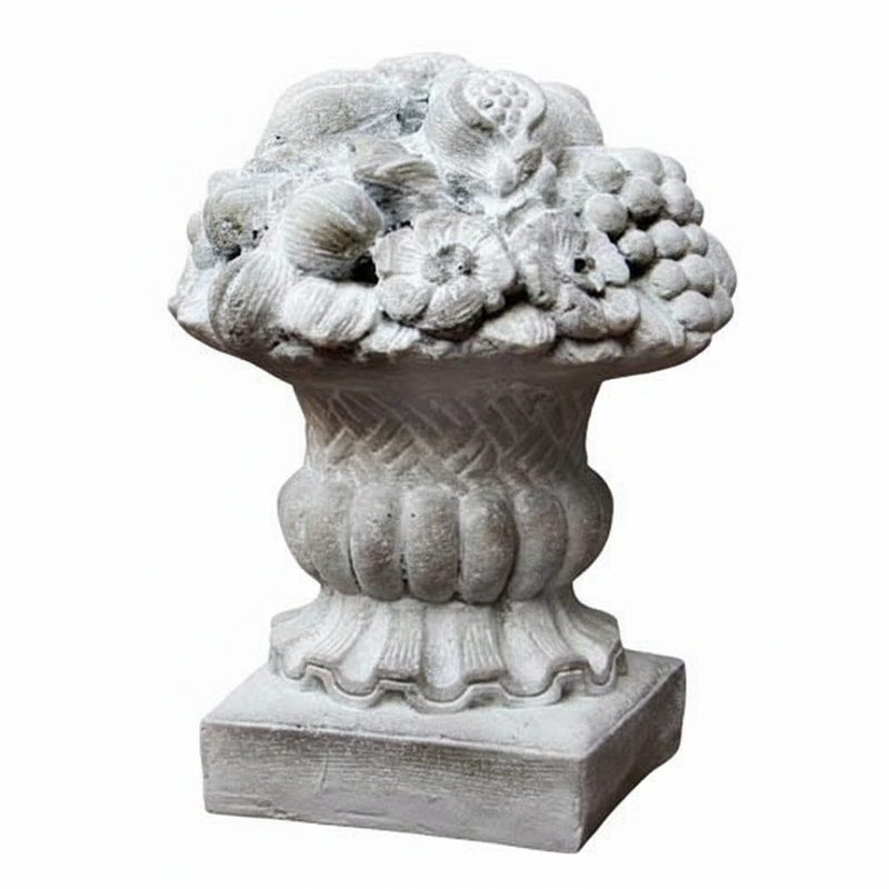 Ornate classical urn with intricate fruit and floral relief, featuring old world European and Baroque decorative detailing.