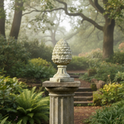 Pinecone finial with classical old world European design, ornate detailing, and a fluted pedestal base on a square plinth. Side Angle