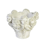 Ornate Baroque-style planter featuring sculpted cherub faces and classical old world European detailing around the rim.