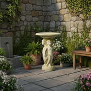 Ornate old world European bird bath with classical cherub figures supporting a round basin, featuring Renaissance-inspired detailing. Side Angle