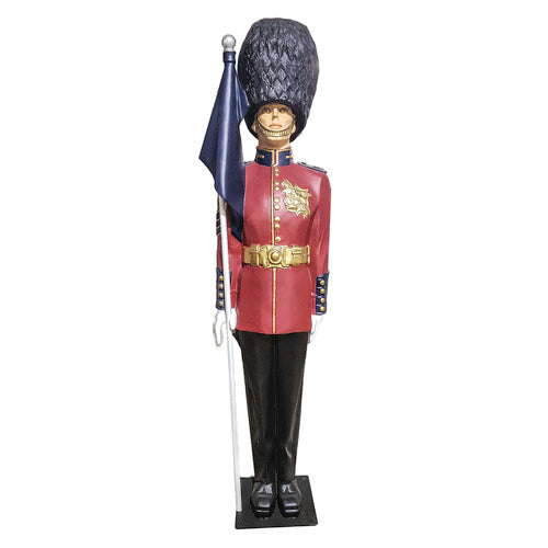 British royal guard statue in ornate old world European style uniform, tall bearskin hat, holding a flag, classical military theme