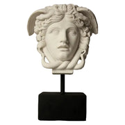 Medusa head sculpture with classical Greek and ornate Baroque details, featuring serpentine hair and dramatic facial expression.