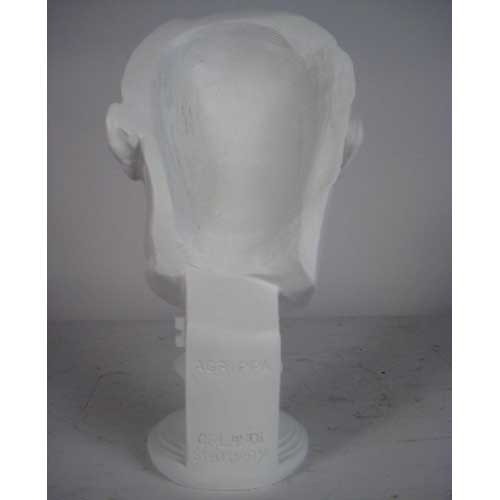 Classical Greco-Roman style male bust with strong features and short wavy hair on an ornate pedestal base. Side Angle