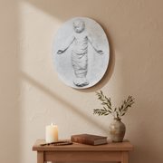 Classical bas-relief of a swaddled child with outstretched arms, featuring ornate old world European Renaissance style detailing. Side View