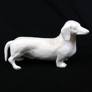 Dachshund figurine with smooth, classical lines and subtle old world European sculptural details Side View