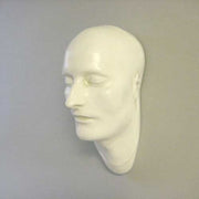 Classical European sculpted head with closed eyes, smooth features, and serene expression, evoking Renaissance and old world style. Side View