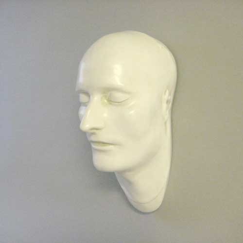 Classical European sculpted head with closed eyes, smooth features, and serene expression, evoking Renaissance and old world style. Side View