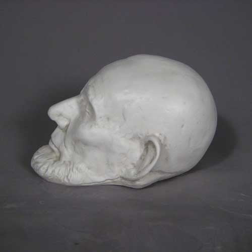 Classical old world European sculpted head with closed eyes, detailed facial features, and a prominent beard in Renaissance style. Additional Angle
