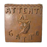 Square plaque with raised “Attenti al Gatto” text and a stylized cat face, featuring old world European, classical design elements.