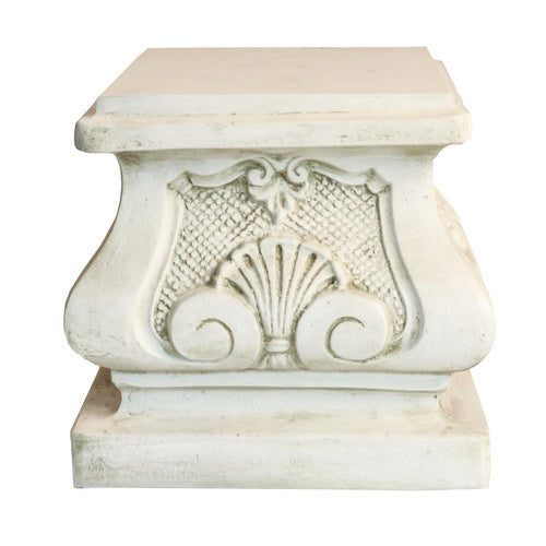 Ornate square pedestal with classical Baroque detailing, featuring shell motifs and intricate scrollwork in old world European style. Side Angle