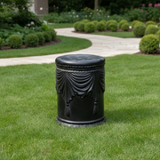 Ornate cylindrical stool with classical draped swag detailing and tassels, inspired by old world European and Baroque design elements. Side Angle