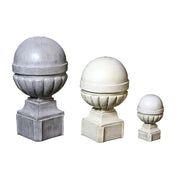 Ornate old world European finials with classical rounded tops and fluted bases, displayed in three graduated sizes on square pedestals.