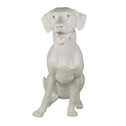Sitting dog statue with classical European sculptural style and detailed, lifelike features in an ornate, old world design.