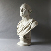 Classical bust sculpture with draped robes, inspired by old world European and Renaissance styles, featuring detailed, lifelike features. Side View