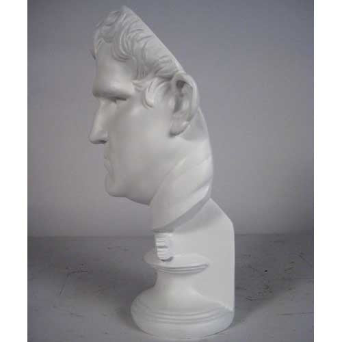 Classical Greco-Roman style male bust with strong features and short wavy hair on an ornate pedestal base. Side View
