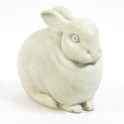 Sculpted rabbit figurine with rounded form and subtle detailing, inspired by old world European and classical garden statuary.