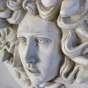 Medusa head relief with intricate serpentine hair, classical Greek style, ornate detailing, and dramatic facial expression. Different Angle