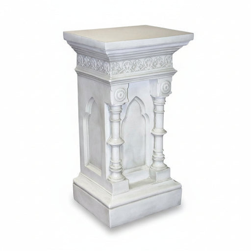 Ornate pedestal with classical Gothic arches, fluted columns, and intricate old world European detailing on the upper border.
