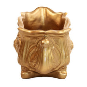 Ornate Baroque planter with intricate floral relief and curved, classical old world European design elements. Side View