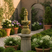 Ornate old world European finial with classical detailing, weathered patina, and sculpted Baroque-inspired accents on a square base. Side Angle