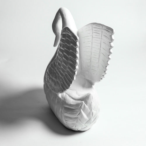 Swan sculpture with detailed feather carvings, classical European style, featuring an elegant curved neck and ornate wing design. Side View