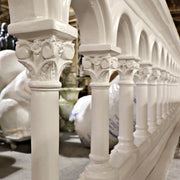 Ornate old world European balustrade with classical arches, Corinthian columns, and decorative Baroque detailing on end panels. Side View