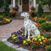 Dalmatian dog statue in a seated pose with classic black spots, sculpted in a naturalistic, old world European style. Side Angle