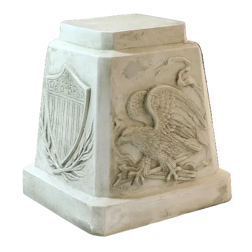Pedestal with classical old world European style, featuring an ornate eagle relief and shield with laurel motif in bas-relief.