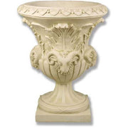 Ornate classical urn with Baroque detailing, featuring sculpted ram heads and intricate leaf motifs in old world European style.