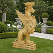 Winged griffin pedestal with ornate Baroque detailing and classical old world European design elements. Side Angle
