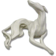 Reclining greyhound sculpture with elongated limbs and elegant curves, featuring classical and old world European style.