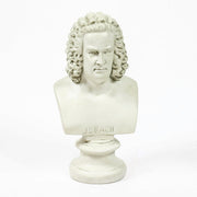 Classical European bust with ornate, curly hair in old world style, displayed on a pedestal with Renaissance-inspired detailing. Side View
