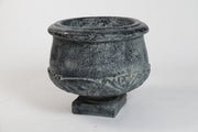 Ornate old world European planter with classical carved scrollwork and pedestal base, featuring a rounded bowl shape. Side View