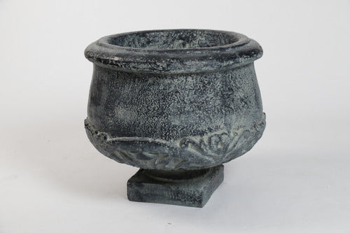 Ornate old world European planter with classical carved scrollwork and pedestal base, featuring a rounded bowl shape. Side View