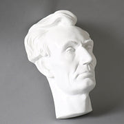 Classical bust sculpture with detailed facial features and stylized hair, inspired by Renaissance and old world European artistry Side View