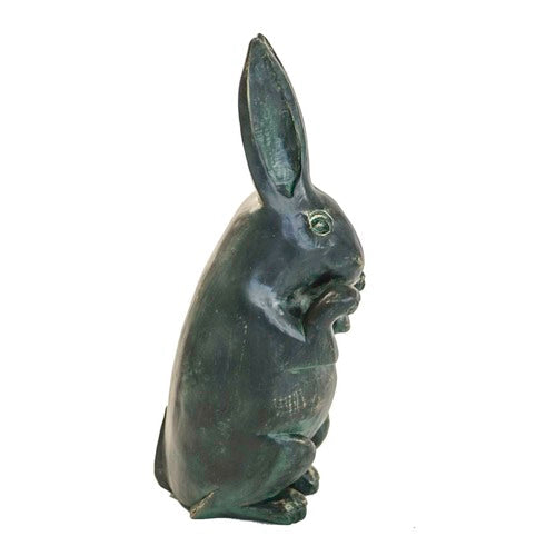 Standing rabbit sculpture with upright ears, detailed paws, and an old world European, slightly weathered, classical style. Side View