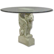 Round glass-top table with ornate, old world European base featuring a classical winged lion in a Renaissance style.