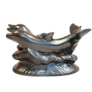 Two ornate dolphins leaping over stylized waves in a classical old world European sculptural design. Other Angle
