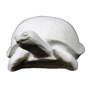 Tortoise sculpture with classical old world European style, featuring smooth, rounded shell and stylized, simplified details.