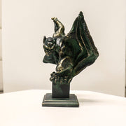 Gothic gargoyle statue with outstretched wings and crouching pose on a square pedestal, featuring ornate medieval detailing. Side View