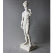 Classical Renaissance male statue with detailed anatomy, standing in contrapposto pose, inspired by old world European sculpture. Side View