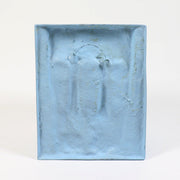 Abstract sculptural wall art featuring two elongated, stylized faces in a minimalist, classical European-inspired design. Side View